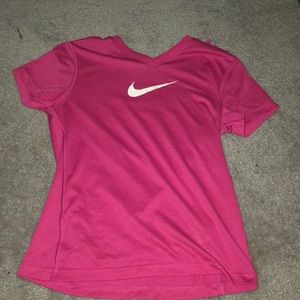 Hot pink nike shirt.